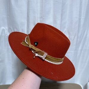 Burnt orange/red flat brim western hat